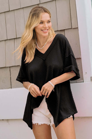 Oddi Dotted Jacquard Knit Top, Short Sleeve with Shark Bite Hem, Available in Two Colors. Stylish and trendy design.