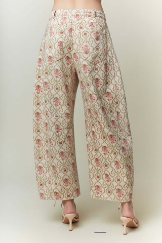 Pink vintage floral gypsy fit denim pants by Peach Love, showcasing intricate designs and a stylish retro flair.