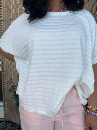 White textured dolman short-sleeve top with ribbed knit fabric and relaxed fit.
