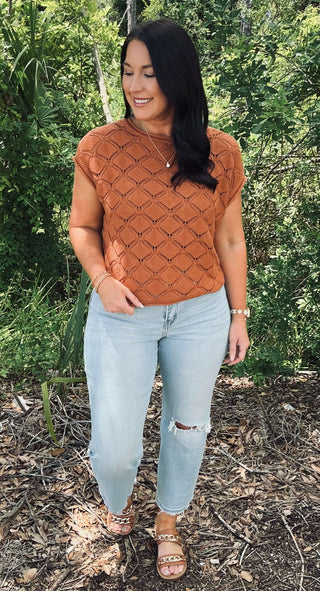 Cozy cable knit short sleeve sweater top available in two colors, perfect for February fashion. Ideal for layering or wearing alone.