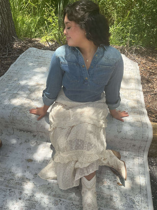 Light blue vintage denim top with pockets and a western yoke design