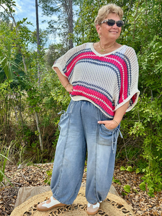 Cream crochet short-sleeve top with raspberry and navy horizontal stripes.
