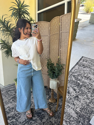 White crochet terry top with eyelet details and short sleeves, oversized fit.
