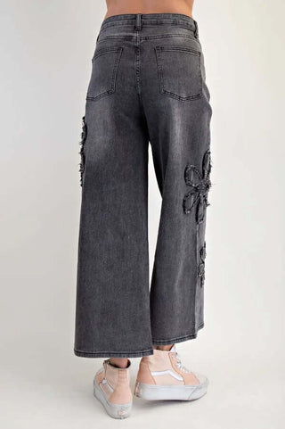 Easel black wide-leg denim daisy stretch pants, final sale, showcasing trendy design and comfort for modern fashion enthusiasts.