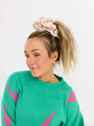 KAXI Oversized Scrunchie in soft pink, adds style and volume to any hairstyle, perfect for all-day comfort and elegance.