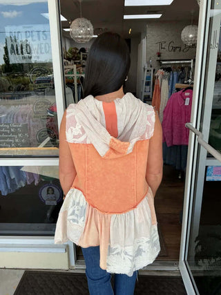 Mineral Wash Orange Ruffle Flare Hem Hooded Vest Top by Oli & Hali – Stylish, unique, and perfect for adding a pop of color.