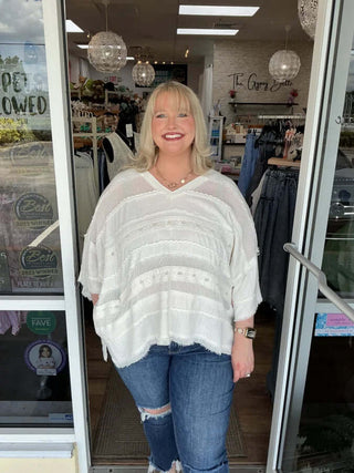 Ivory Mix Fabric V Neck Oversized Top by Oli & Hali on a mannequin, showcasing its relaxed fit and elegant design.