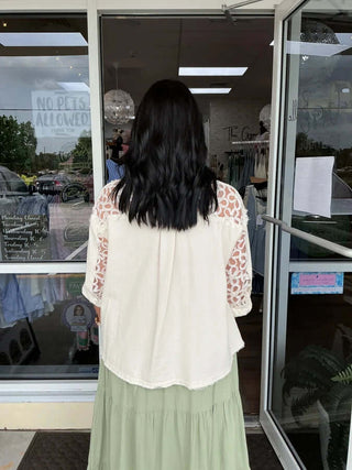 POL Ivory Pearl Floral Shoulder Button Down Top with elegant floral print and shoulder button accents, perfect for chic styling.