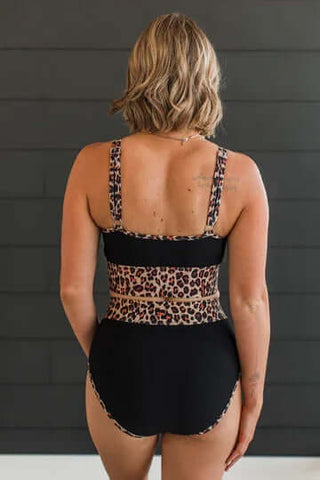 Black & Leopard Ribbed Two-Piece Swimsuit Set on Display - Final Sale. Stylish beachwear with a bold animal print accent.