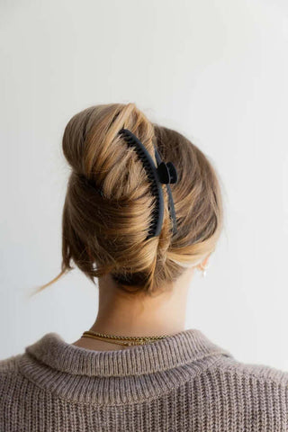 Stylish KAXI Hold Everything Claw Clip in various colors, perfect for secure hair styling and fashion-forward looks.