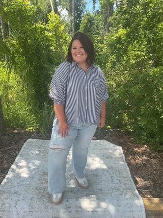 Light blue and white striped oversized button-down shirt with ruffle pockets