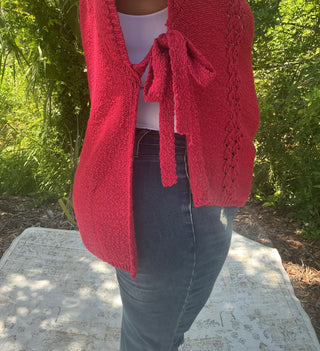 Light gray short sleeve poncho sweater with crochet accents and side ties