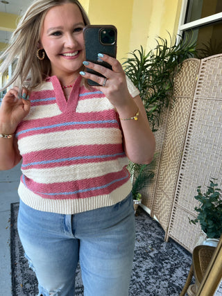 Dusty red, cream, and blue striped knit sweater vest with short sleeves.
