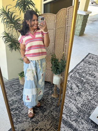 Red, cream and blue striped short-sleeve sweater top with ribbed knit detail.
