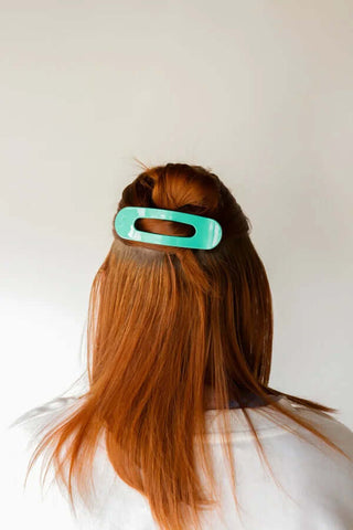 Colorful KAXI Lay Down Claw Clips for versatile styling in a vibrant display, perfect for all hair types.