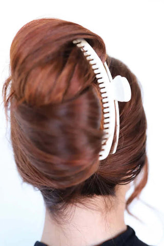 KAXI Hold Everything Claw Clip in vibrant colors, perfect for all hair types. Stylish and versatile hair accessory.