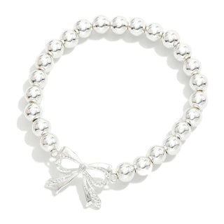 Elegant silver bead stretch bracelet with bow, perfect for adding a stylish touch to any outfit.