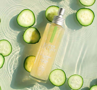 Farmhouse Fresh Super Lettuce Facial Tonic bottle on rustic wooden table with fresh lettuce backdrop
