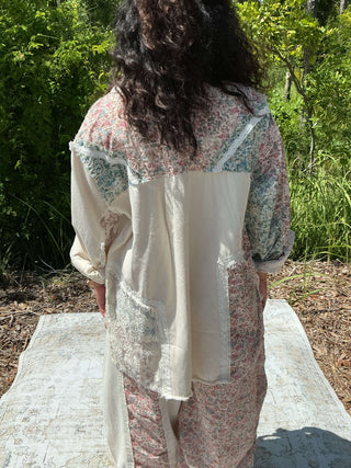 Ivory hi-lo shacket top with floral print and crochet detail, perfect for layering in any season