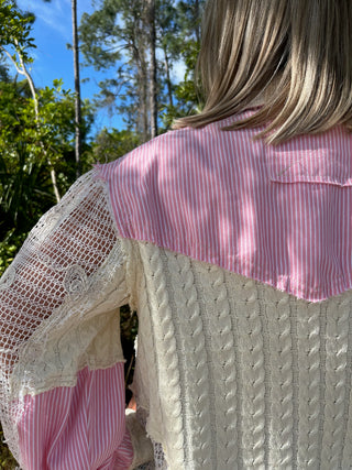 Pink and white striped shacket with cream lace sleeves and textured knit back.
