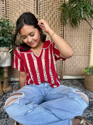 Red and white striped pointelle crochet short-sleeve top with scalloped neckline.
