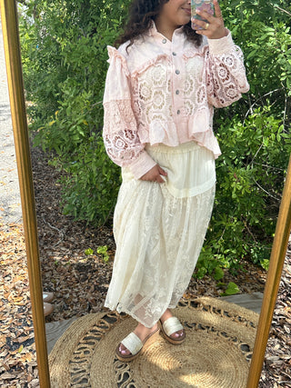Blush lace shacket with puff sleeves and button front over cream lace skirt.
