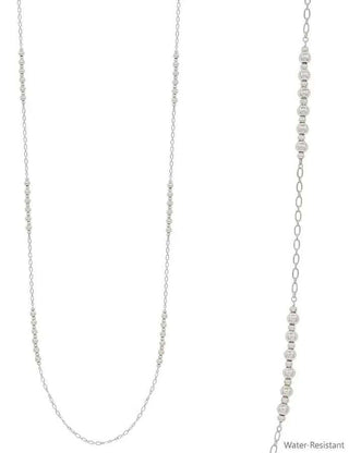 Elegant silver bead and dainty chain long necklace displayed on a white background for a chic, minimalist style accessory.