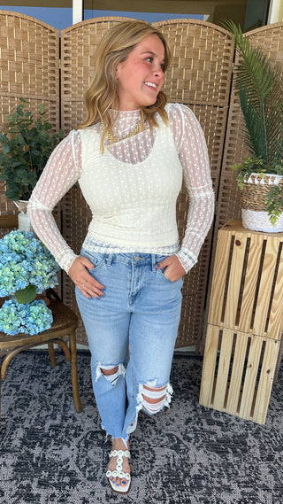 Ivory ditzy floral mesh long sleeve layering top with sheer sleeves and fitted silhouette.
