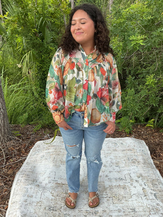Light yellow button-down blouse with a sunflower print and short sleeves