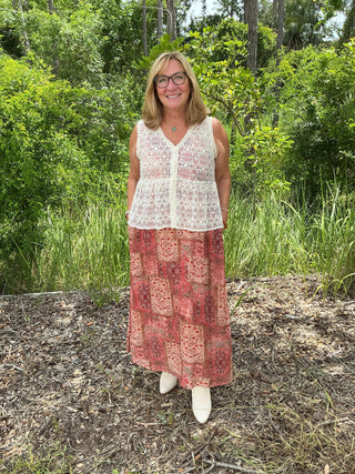 Polagram Terracotta Dream Floral Patchwork Maxi Dress on Model - Stylish Bohemian Maxi with Floral Patterns and Flowy Design.