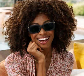 Stylish Skipper Black Sun Readers by Peepers with durable frames and tinted lenses, perfect for outdoor reading.