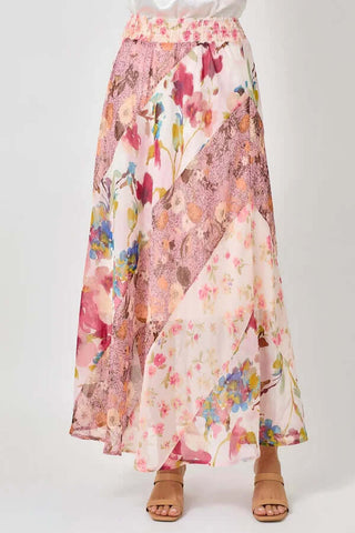 Pink floral mix print maxi skirt with flowing design, featured as a final sale item. Perfect for a chic, elegant look.