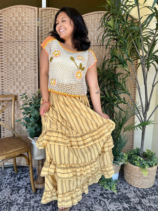 Yellow maxi skirt with olive stripe pattern and tiered ruffle hem.
