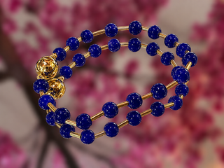 Cobalt blue glass bead bracelet with gold-tone spacers and magnetic clasp.
