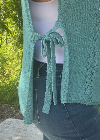 Light gray short sleeve poncho sweater with crochet accents and side ties