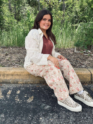 Pink Vintage Floral Gypsy Fit Denim Pants by Peach Love, featuring a stylish bohemian design for a trendy fashion statement.