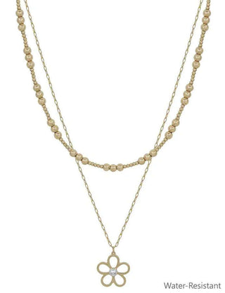 Elegant gold bead necklace & dainty chain adorned with an open flower pearl charm, adding a touch of sophistication.