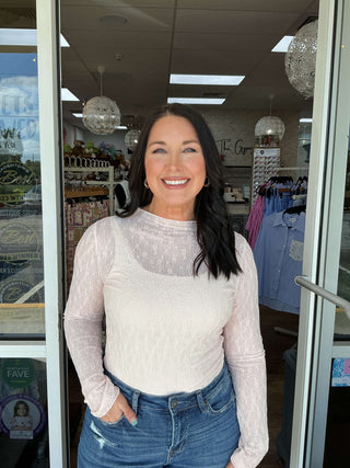 Dusty pink lace layering top with round neck and bows, featuring long sleeves for a chic, feminine look.