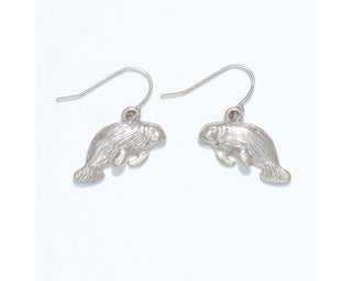 Silver textured manatee charm earrings with hook closure.
