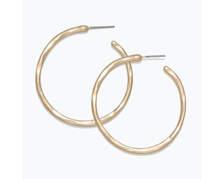 Gold matte hammered hoop earrings with textured finish and post backs.
