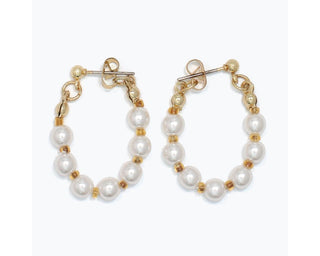 Gold hoop earrings with white pearls and gold beads alternating on chain links.
