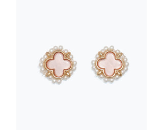 Pair of clover-shaped stud earrings with blush pink inlay, gold trim, and pearl beaded border.
