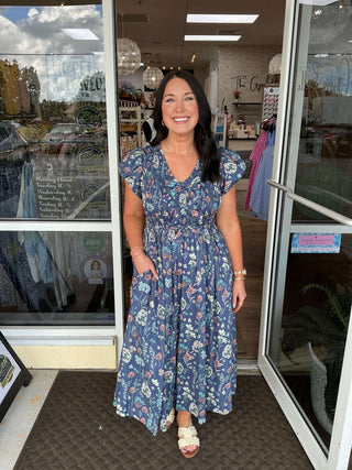 Midnight Blue Floral Cap Sleeve Midi Dress with Bow Accent by Entro – Elegant, Stylish, and Perfect for Any Occasion.
