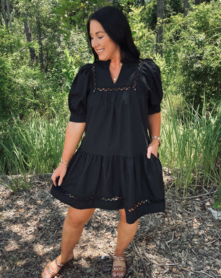 Entro black dress with short sleeves, scallop accent trim, and pockets; perfect for stylish and comfortable wear.