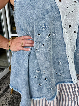 Light blue chambray oversized tank top with white eyelet embroidery and distressed edges.