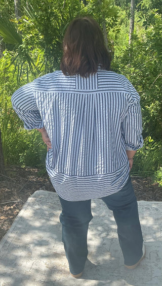 Light blue textured stripe long sleeve button-down shirt with a relaxed fit and classic collar
