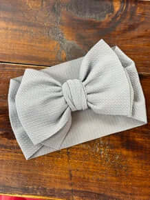 Grey oversized headband bow for baby girls with soft, comfortable material and stylish design. Perfect for any occasion.