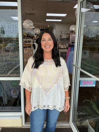 Lavender & Ivory Eyelet Patchwork Boxy Top by Oli & Hali displayed on a hanger against a bright white background.