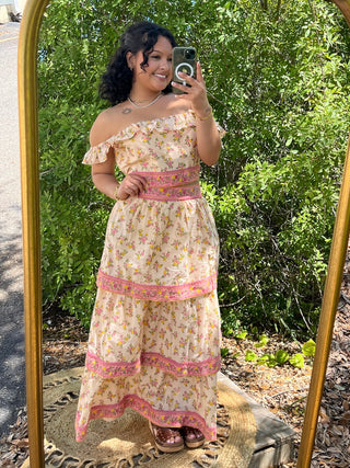 Cream floral off-shoulder maxi dress set with pink trim and ruffled details.
