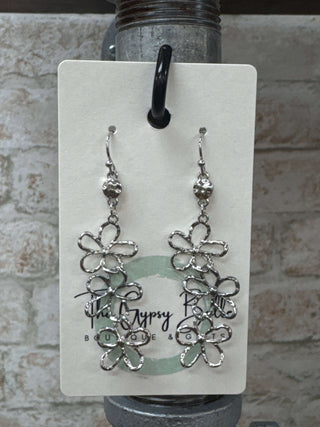 Elegant silver linked hollow flower drop earrings with intricate design, perfect for enhancing any outfit with a touch of sophistication.